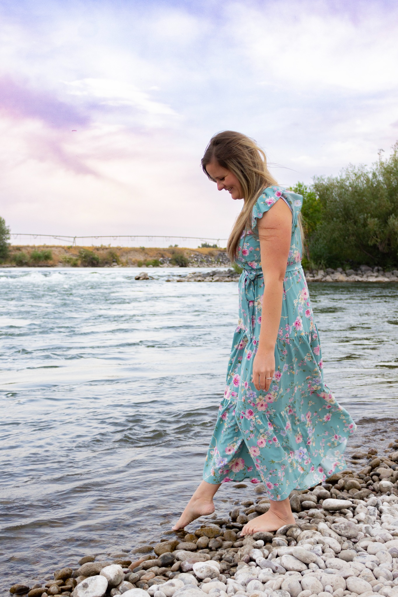 Shalese Bruce walking along a rocky riverbank